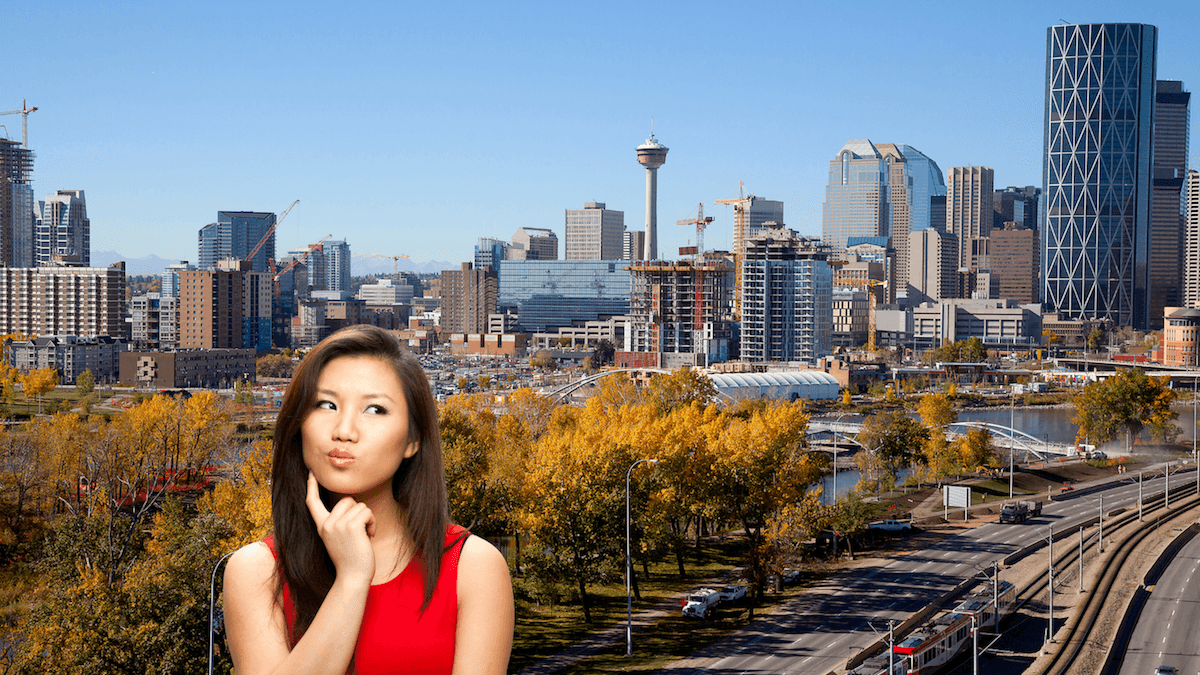 A woman overlooking the Calgary skyline in autumn