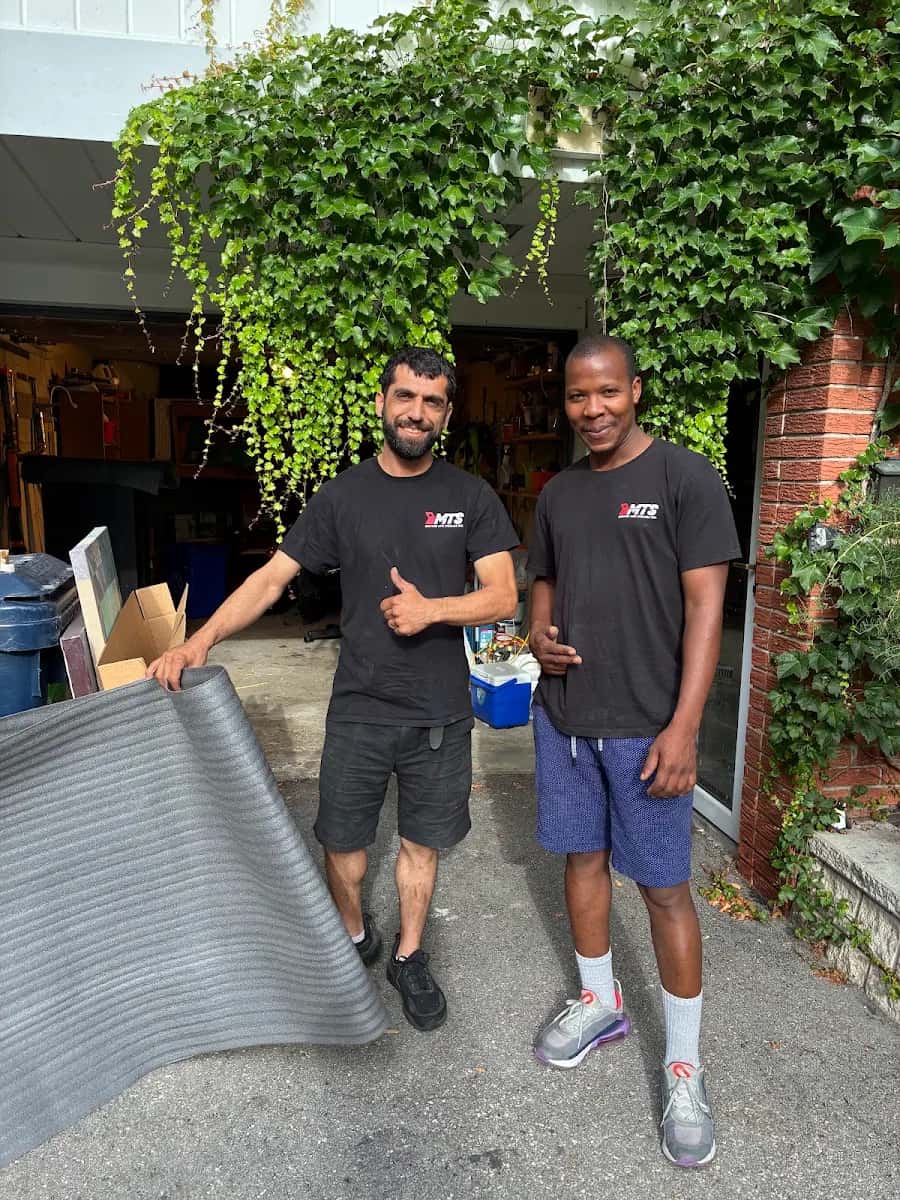 Movers preparing packing materials